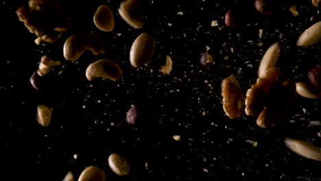Mixed-Nuts-Falling-down-from-top-In-Slow-Motion,Black-Background