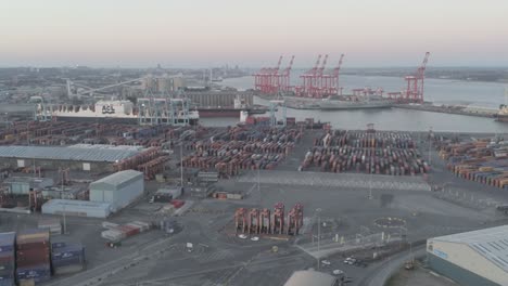 Aerial-view-across-Peel-Port-harbour-distribution-cargo-freight-shipyard-pull-back