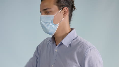 Close-up-view-of-a-young-man-wearing-a-face-mask