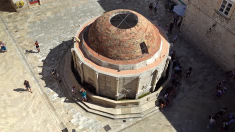 Shot-from-above-of-Onofrio's-Fountain-on-the-west-side-of-old-town-Dubrovnik-during-covid-times