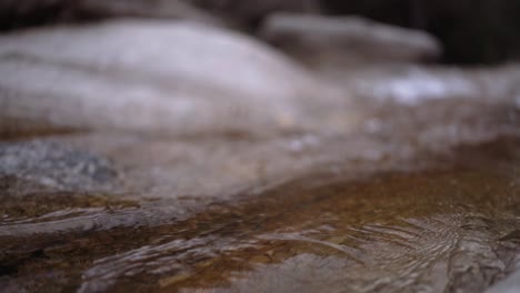 Tracking-Slow-Motion-Shot-of-Waterfall-Stream-of-Water-to-Falloff-Point