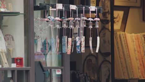 Decorative-Japanese-Wind-Chimes-Moved-By-The-Wind-In-Tokyo,-Japan---close-up