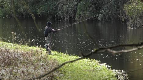 Fisherman-casting-on-the-river-Don-Aberdeenshire,-Scotland