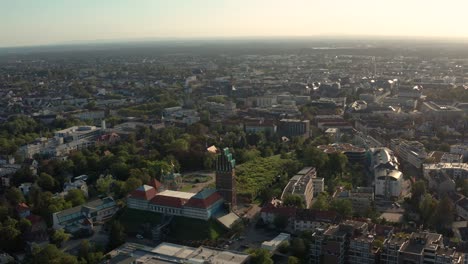 Wide-overview-shot-of-Jugendstil-center-Mathildenhoehe-in-Darmstadt-with-the-down-town-city-in-the-background-with-a-drone-on-a-sunny-summer-day