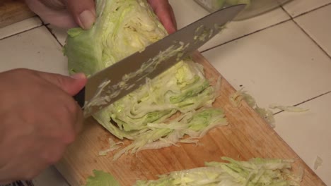 Lettuce-sliced-in-small-parts-on-a-cutting-board