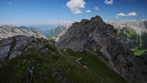 Hikers-walking-near-the-mountain-top-of-an-alpine-mountain-in-Liechtenstein