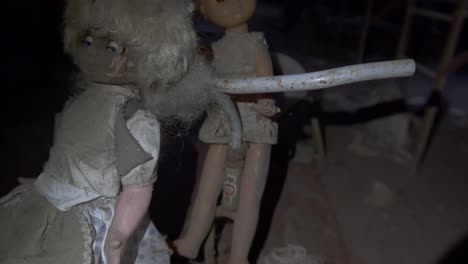 Old-dusty-dolls-in-an-abandoned-kindergarten-house-in-Chernobyl--tilt-up