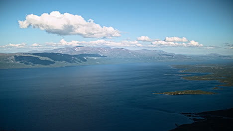 Time-lapse-of-moving-clouds-over-lake-Torneträsk,-seen-from-mount-Nuolja