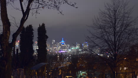 Vancouver-Lookout-At-Downtown-City-Viewed-From-Commercial-Drive-At-Night---time-lapse,-wide-shot
