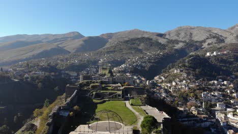 Beautiful-medieval-castle-of-Gjirokastra-built-on-hill-with-city-houses-background