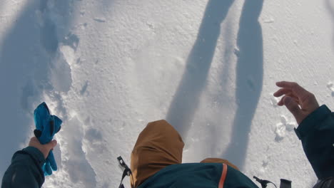 a-man-trekking-a-sunny-winter-mountain