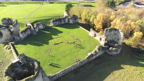 Ancient-Flint-castle-medieval-heritage-military-Welsh-ruins-aerial-view-landmark-birdseye-left-orbit