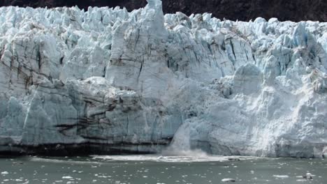 Ice-melting-from-the-Margerie-Glacier-and-falling-in-the-bay-waters,-Alaska