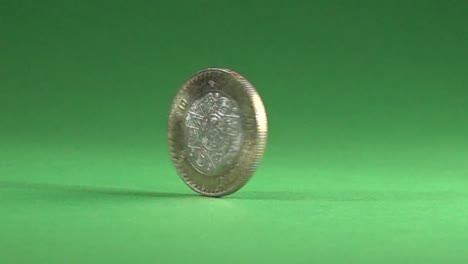 Mexican-coin-spinning-in-a-chroma-background