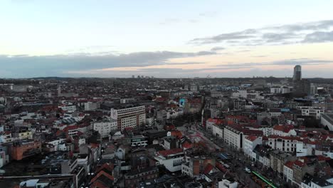 Aerial-panaromic-pan-from-right-to-left-view-flight-of-Brussels-city-on-cloudy-day,-Belgium