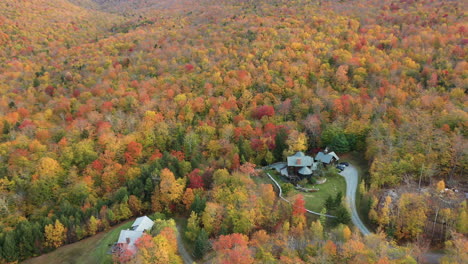 Hidden-Houses-in-Colorful-Autumn-Landscape-of-Vermont,-USA,-Aerial-View