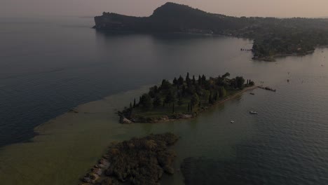 Aerial-view-on-Rocca-di-Manerba,-San-Biagio-small-island-on-lake-Garda,-Italy
