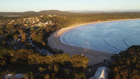 Wide-revealing-drone-shot-of-Scotts-Head-beach-and-town-in-Australia