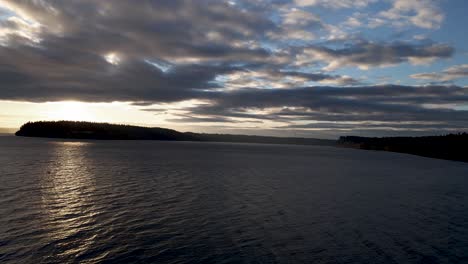Wide-sweeping-aerial-panorama-of-sunrise-over-Point-Defiance-and-Puget-Sound-Washington