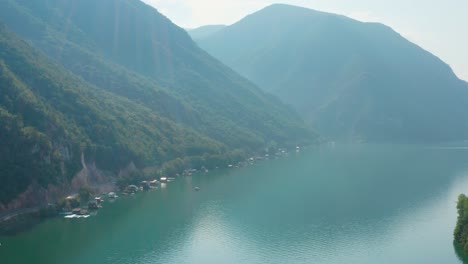 Beautiful-misty-mountain-lake-in-Perucac,-Serbia--aerial