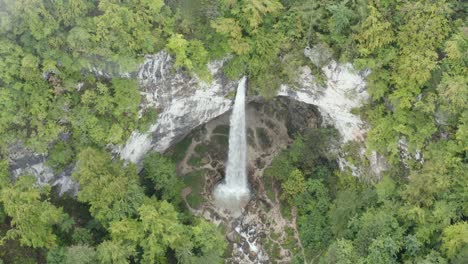 Wildenstein-Waterfall-seen-from-above-in-the-southern-Austria-with-misty-spray,-Aerial-top-dolly-out-shot
