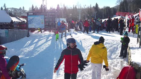 Big-crowd-of-skiers-queuing-up-to-the-Szrenica-mountain-chairlift-in-Szklarska-Poreba-resort-during-winter-school-holidays,-Karkonosze-mountains,-Poland