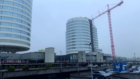 Wide-shot-of-german-hospital-buildings-during-construction-site-with-parking-cars
