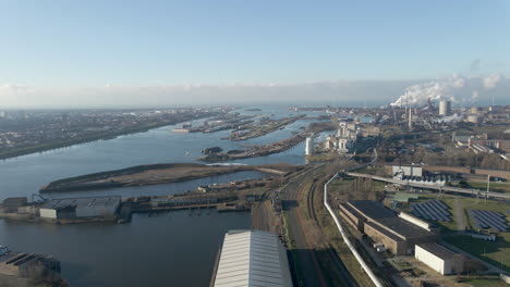 Aerial-of-large-industrial-terrain-with-ship-lock-in-river