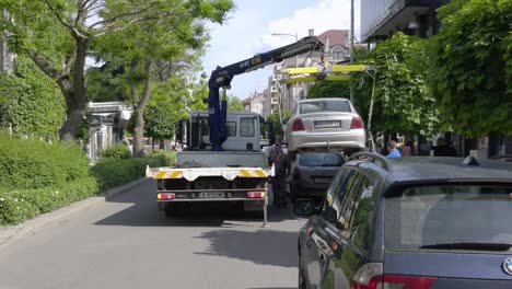 Tow-Truck-Lifting-And-Loading-Car-In-Burgas,-Bulgaria---rearview,-static-shot