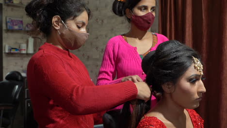 In-Dehradun-Uttarakhand-India,-Girls-making-hair-of-bride-in-Beauty-parlor
