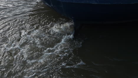 Boat-with-a-motor-under-water-splashing-the-water-surface