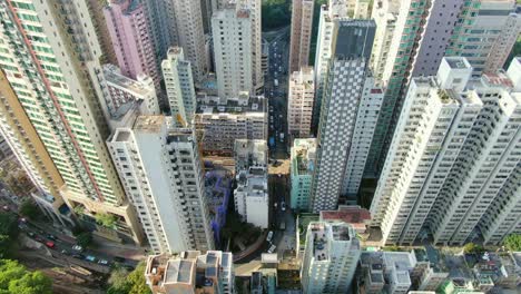 Mega-residential-buildings-and-traffic-in-downtown-Hong-Kong,-Aerial-view