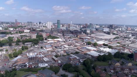 Rise-up-aerial-shot-over-Birmingham-city-centre-on-a-bright-day