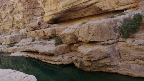 Turquoise-pools-at-Wadi-Shab-canyon,-Oman,-handheld-medium-shot