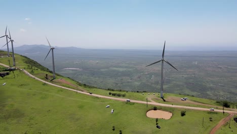 Green-renewable-wind-energy-fighting-deforestation-on-planet-earth-against-climate-change,-Emergency-development-of-wind-mill-in-Nairobi-kenya,-Eco-friendly-towards-the-Paris-Agreement
