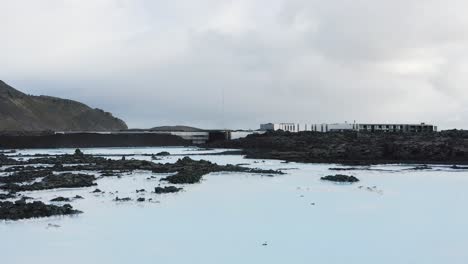 Outside-Blue-Lagoon-wellness-facility-in-Iceland-with-milky-geothermal-pools