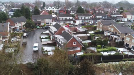 Snowy-aerial-village-residential-neighbourhood-Winter-frozen-North-West-houses-and-roads-dolly-right-slow-shot