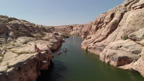 Colorful-kayaks-paddle-on-the-beautiful-Little-Colorado-river-canyon