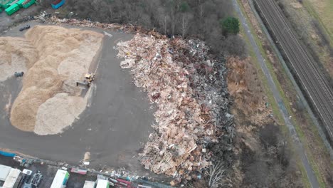 Aerial-Shot-Of-Discarded-Construction-Materials-At-A-Landfill-Waste-Station,-Environmental-Pollution-Issue