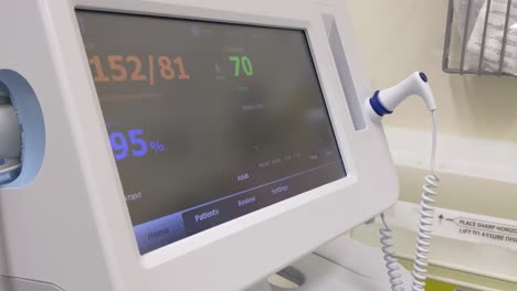 Slow-pan-across-a-patient-monitor-in-a-hospital-that-is-displaying-patient-readings