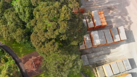 Top-view-on-stacks-of-air-drying-timber-planks-next-to-sinkhole-in-Mount-Gambier