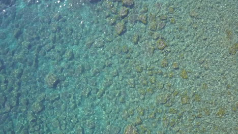 Calm-waves,-transparent-clear-sea-water-at-summer-tropical-beach-aerial-view