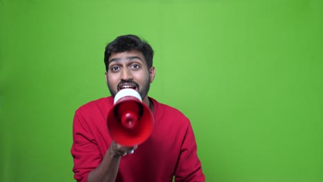 Indian-Man-on-green-screen-chroma-key-background-holding-a-megaphone