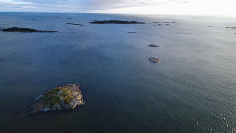 Drone-footage-of-the-bright-sun-over-the-blue-sea