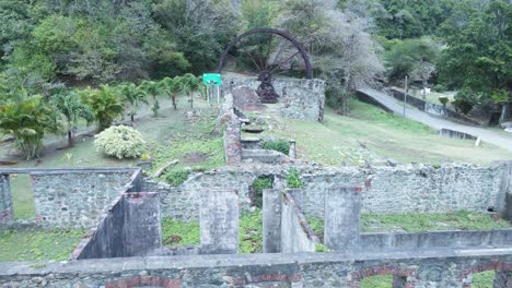 Ancient-ruins-of-a-water-wheel-and-sugar-cane-factory-on-the-Caribbean-island-of-Tobago-in-Speyside