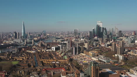 Establishing-Aerial-View-of-Tower-Bridge,-Shard,-London-Skyline,-London,-United-Kingdom