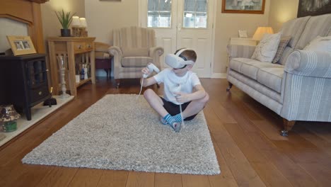 Child-with-virtual-reality-goggles-plays-in-living-room