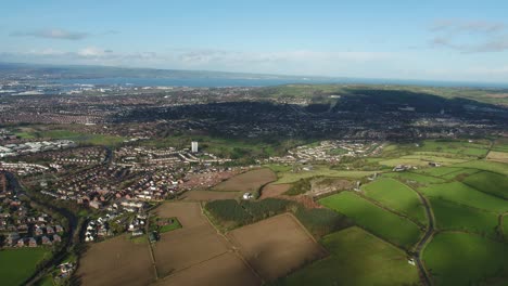 Aerial-flyover-of-east-Belfast-from-the-countryside-looking-towards-the-city-centre-or-center