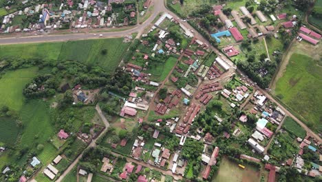 Birdseye-Aerial-View-of-Loitokitok-City,-Kenya-in-Valley-Under-Mount-Kilimanjaro-National-Park,-60fps-Drone-Shot