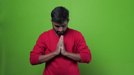 Portrait-of-happy-Indian-guy-on-green-screen
